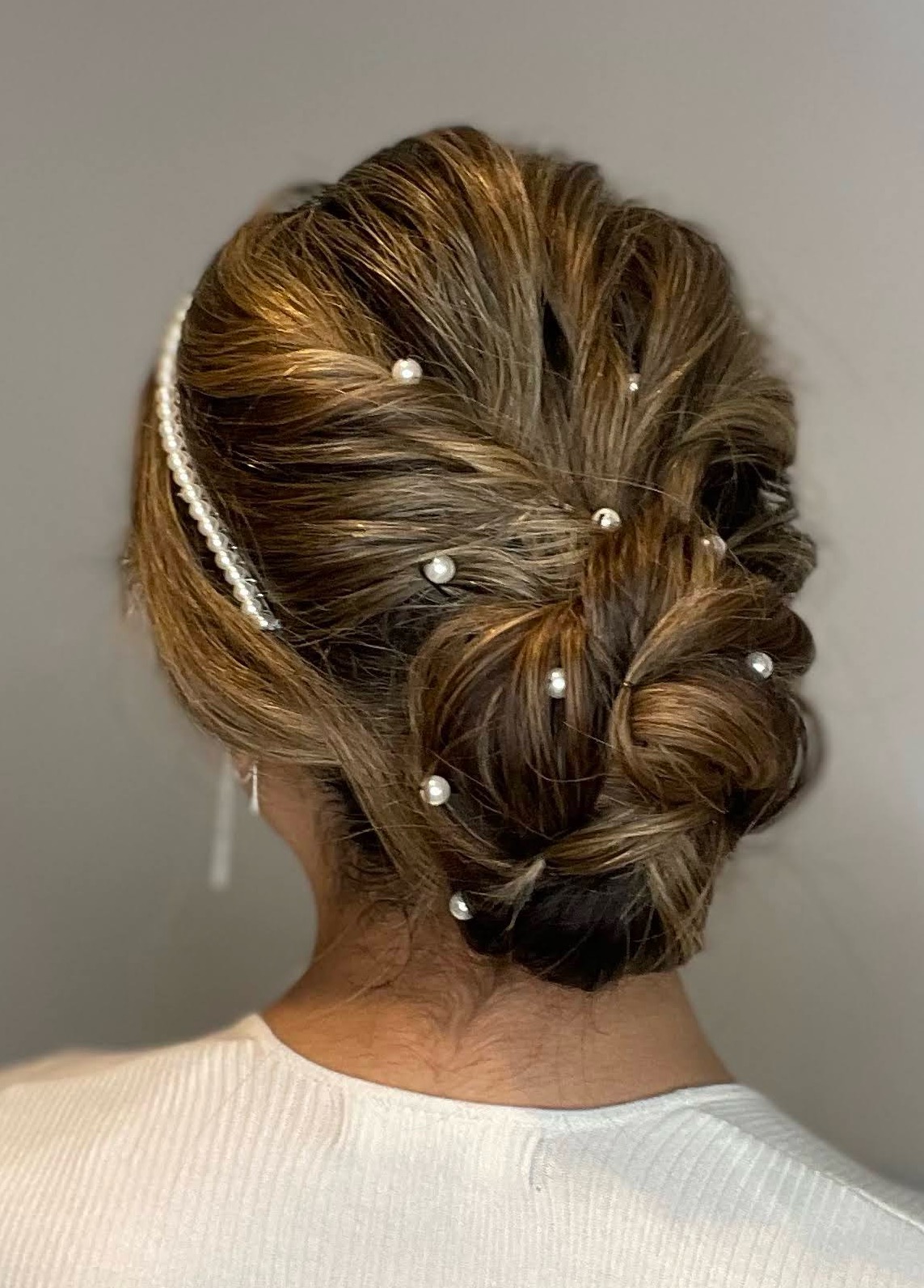 Soft glam bridal look with gold accessories